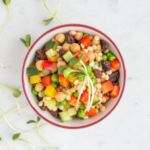 dinner in a lactose-free box diet - Moroccan salad with pearl couscous, pepper, cucumber, raisins, peas and chickpeas
